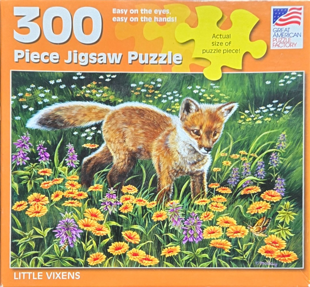 A young fox standing in a vibrant meadow filled with yellow and purple wildflowers.