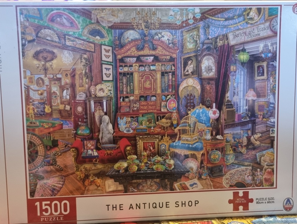 An intricately detailed, cluttered antique shop filled with vintage treasures, furniture, and decorative items.