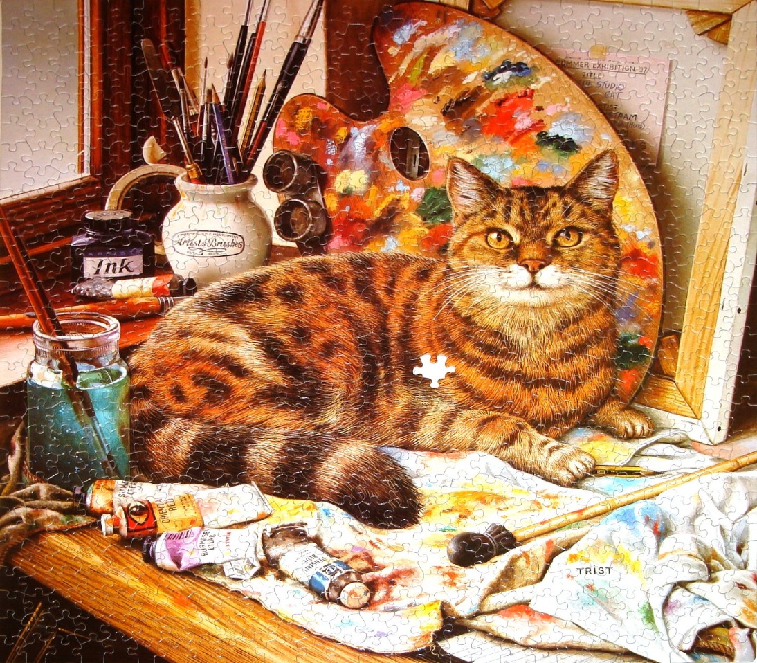 A detailed oil painting of a tabby cat sitting in an artist's studio surrounded by paint supplies.
