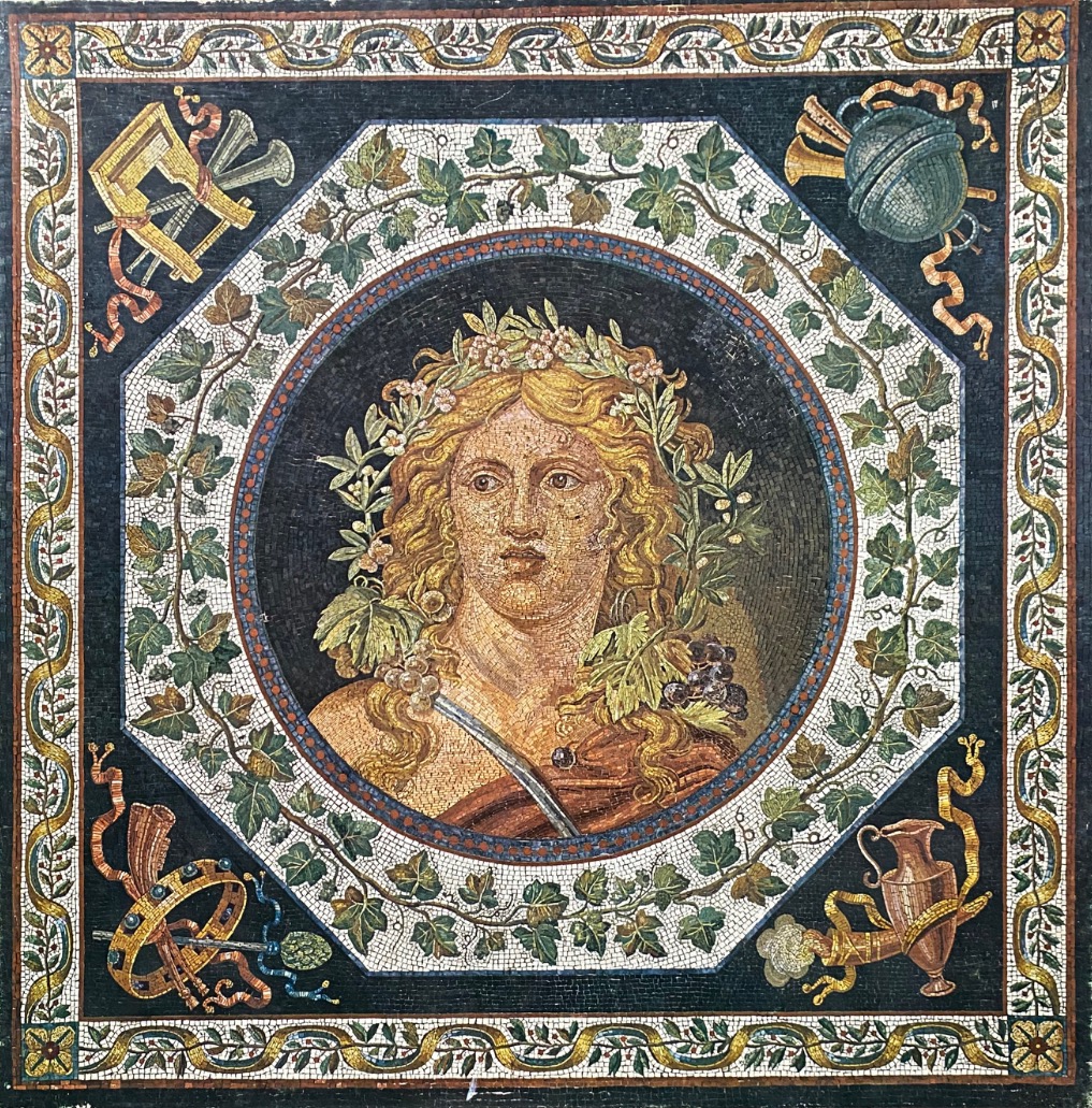 A Roman-style mosaic of a crowned woman surrounded by grapevines and classical instruments.
