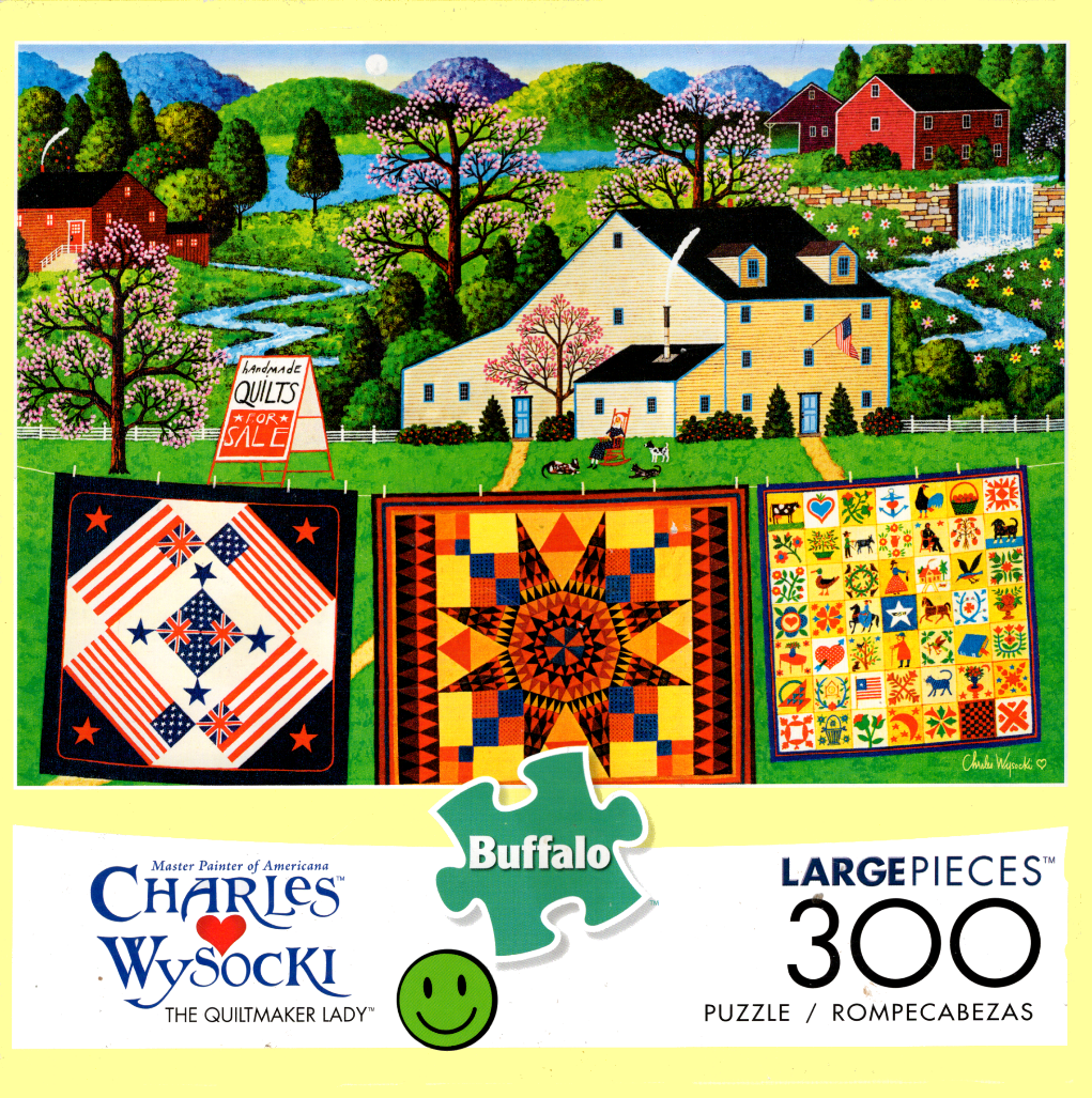 Folk art scene showing a quaint country home with quilts hanging on a clothesline in the foreground.