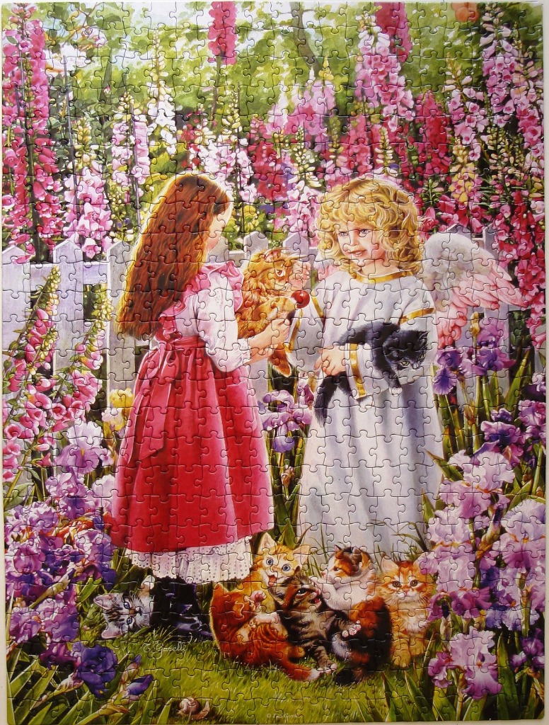 A young girl and an angel share kittens in a vibrant garden of foxgloves and irises.