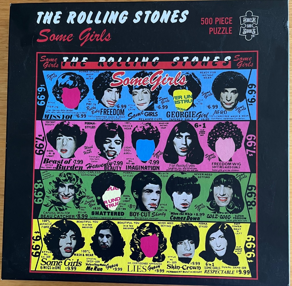 Artwork featuring a grid of black and white celebrity faces with colorful wig styles and pop-art aesthetic.