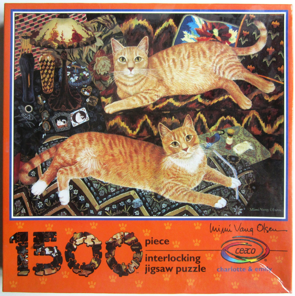 Two ginger tabby cats lounging on ornate patterned furniture in a cozy, cluttered room.
