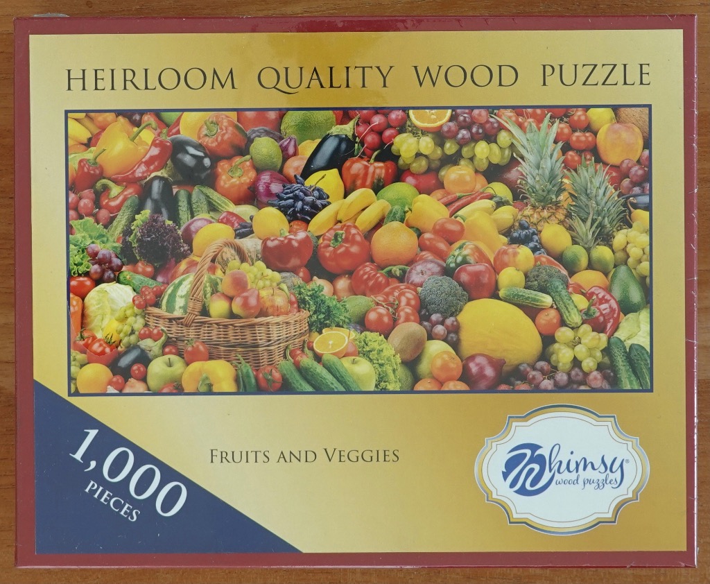 A dense and colorful still life arrangement of various fresh fruits and vegetables in a market display.