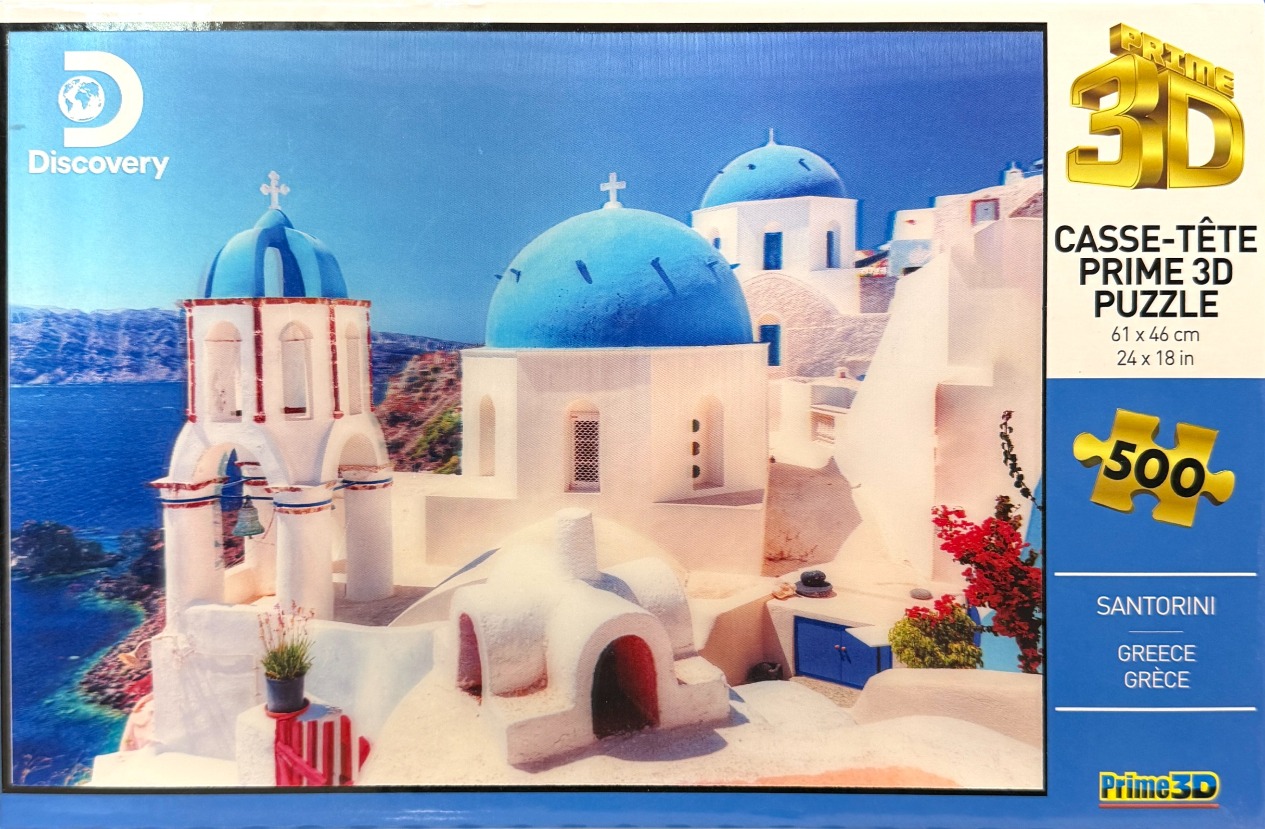Iconic white buildings with blue domes overlooking the deep blue sea in Santorini, Greece.