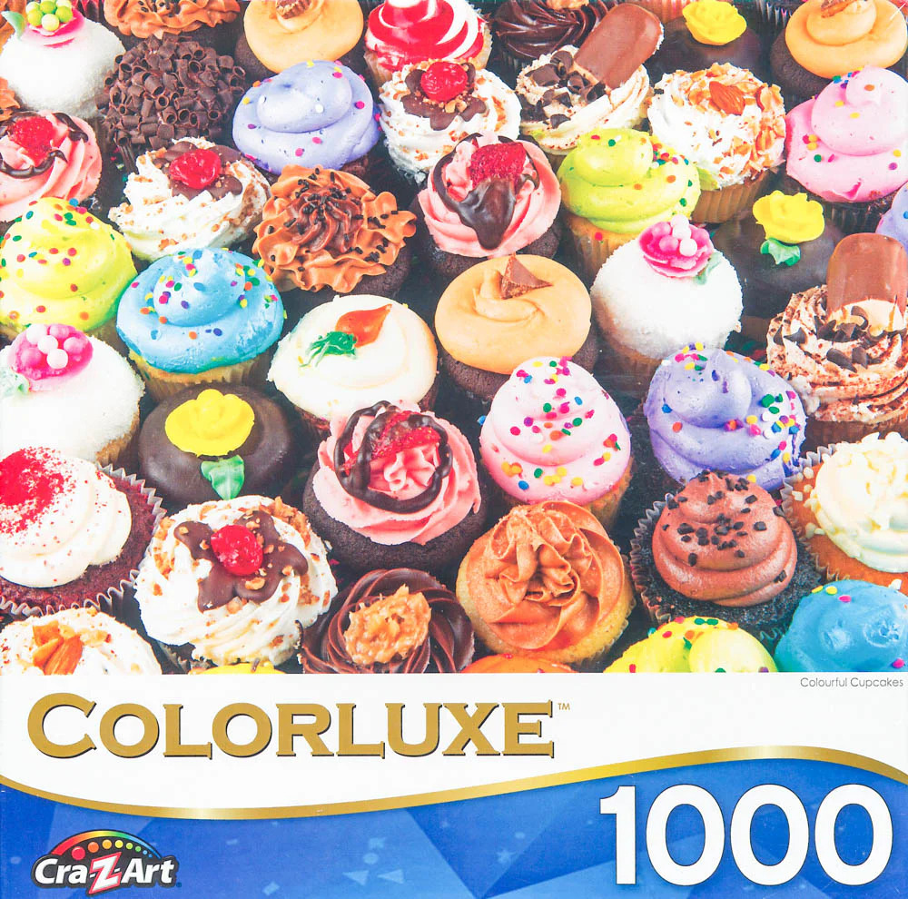 A close-up, high-angle collection of numerous colorful, decorated cupcakes filling the entire frame.