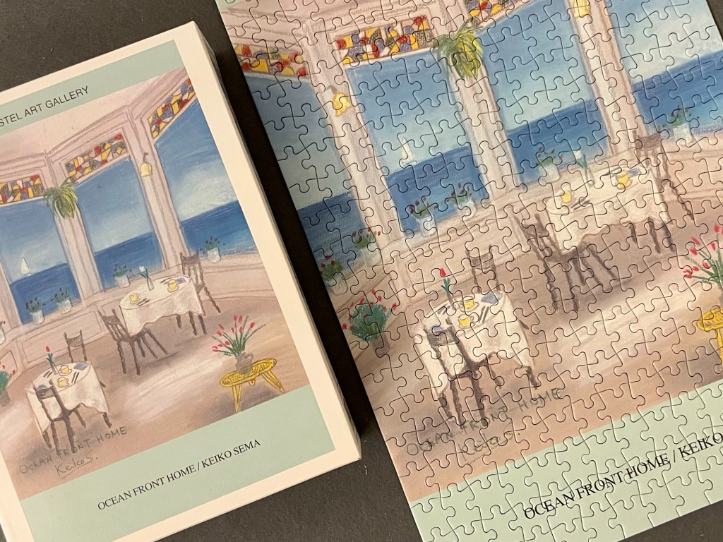 An impressionistic painting of a seaside cafe dining area overlooking the ocean.