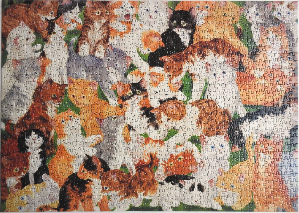 A dense illustration of many kittens in various colours and patterns piled together.