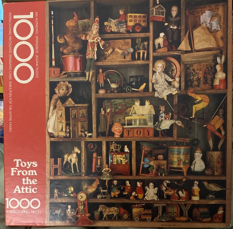 Vintage wooden shelving unit filled with antique toys and dolls
