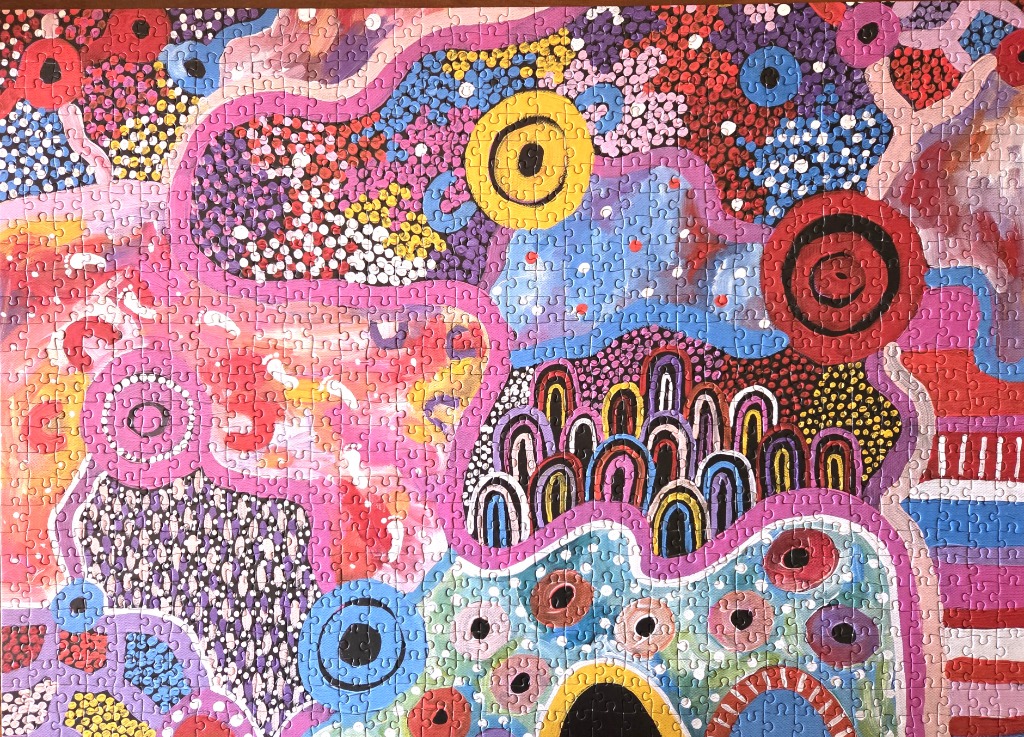 Indigenous-style dot painting with vibrant abstract patterns, concentric circles, and undulating organic shapes.