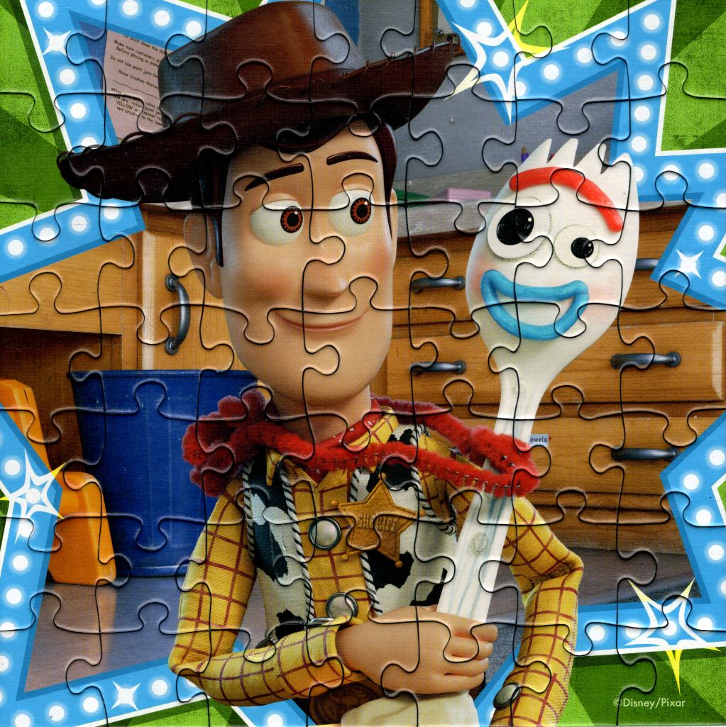 Woody from Toy Story holding Forky against a wooden cabinet background
