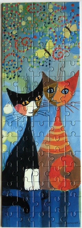 Stylized painting of two cats, one black and white and one orange striped, against a whimsical blue background with butterfli