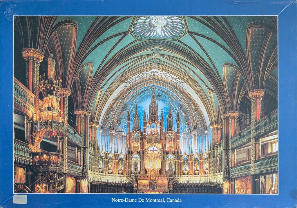 Interior view of the Notre-Dame Basilica in Montreal with blue vaulted ceilings and ornate golden altar
