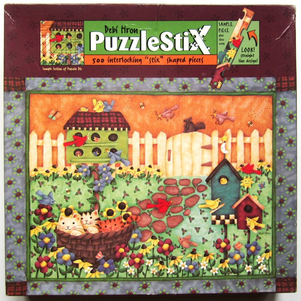 Folk art illustration of a garden with a birdhouse, a basket of kittens, and various birds and flowers.