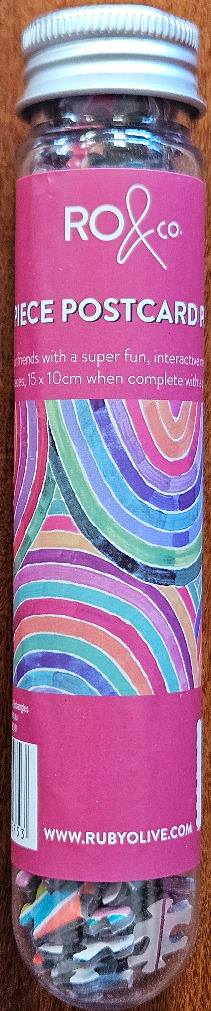 Abstract design of colourful concentric semi-circles in shades of pink, purple, teal, and orange.