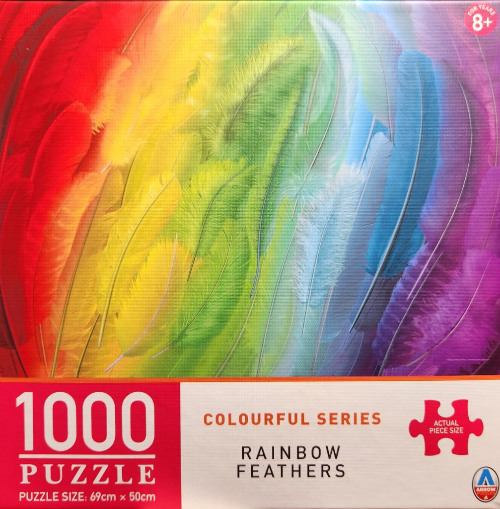 A gradient of rainbow-coloured feathers overlapping across the frame.