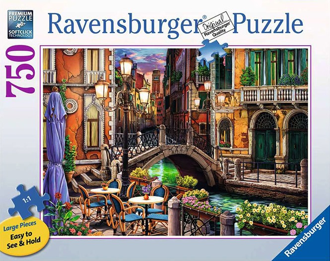A romantic canal scene in Venice at twilight with cafe seating, a stone bridge, and old Venetian buildings.