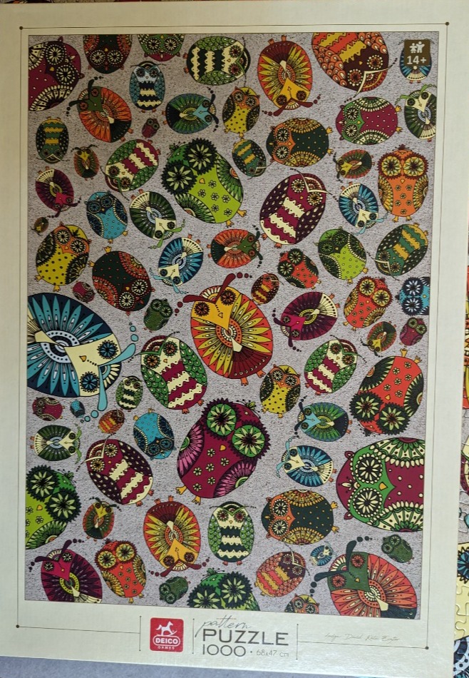 A collection of whimsical, patterned, and stylized owls in various colors scattered across a textured grey background.
