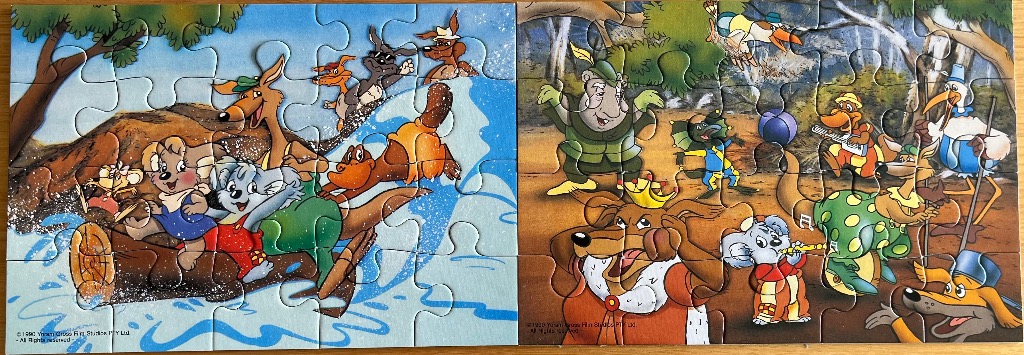 Cartoon scene featuring anthropomorphic Australian animals like kangaroos and koalas playing in water and music.