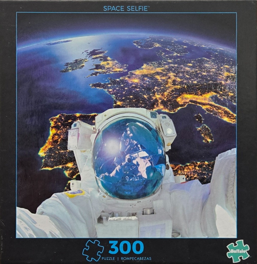 An astronaut taking a selfie in outer space above a glowing Earth at night.