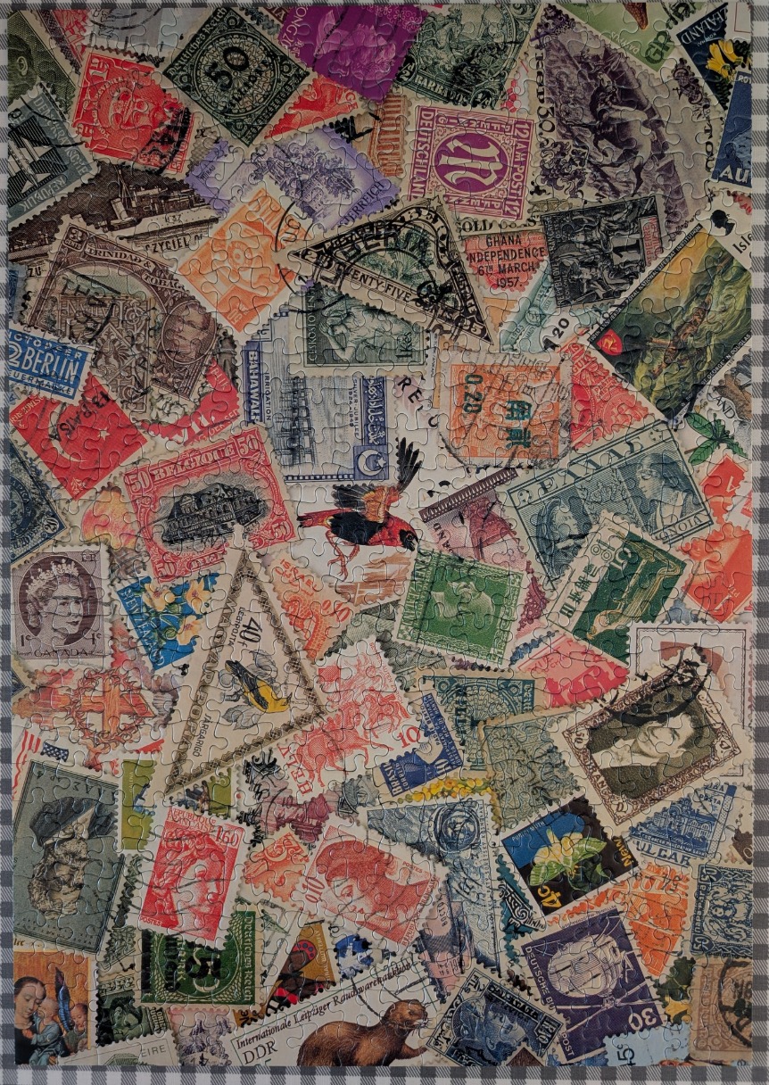 A dense, colorful collage of vintage postage stamps from various countries.