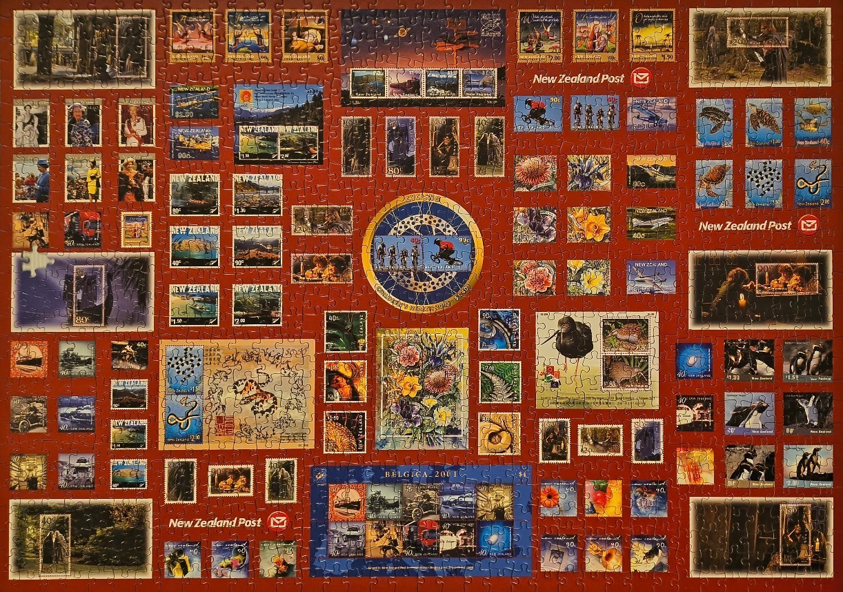 A collage of various New Zealand postage stamps arranged against a solid dark red background.