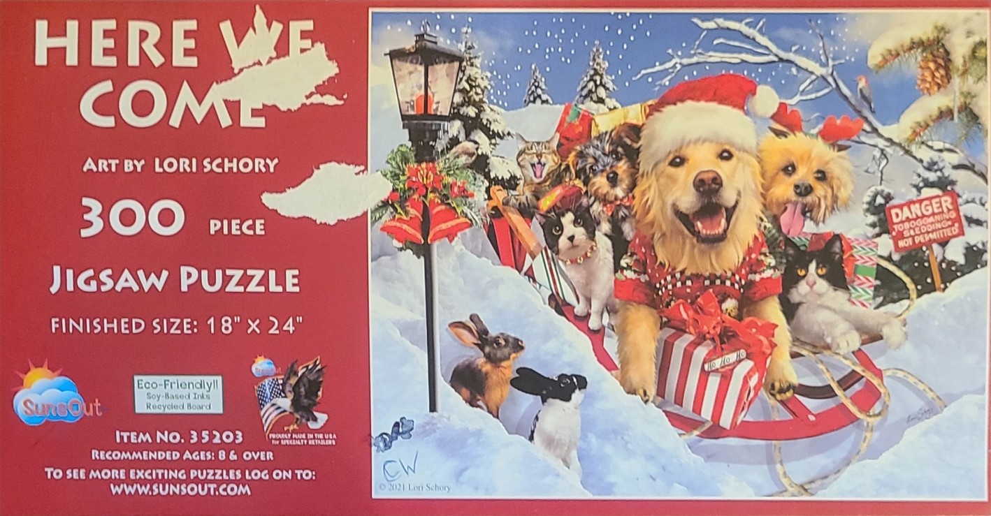 A group of dogs, cats, and rabbits riding on a red sled in a snowy Christmas landscape.