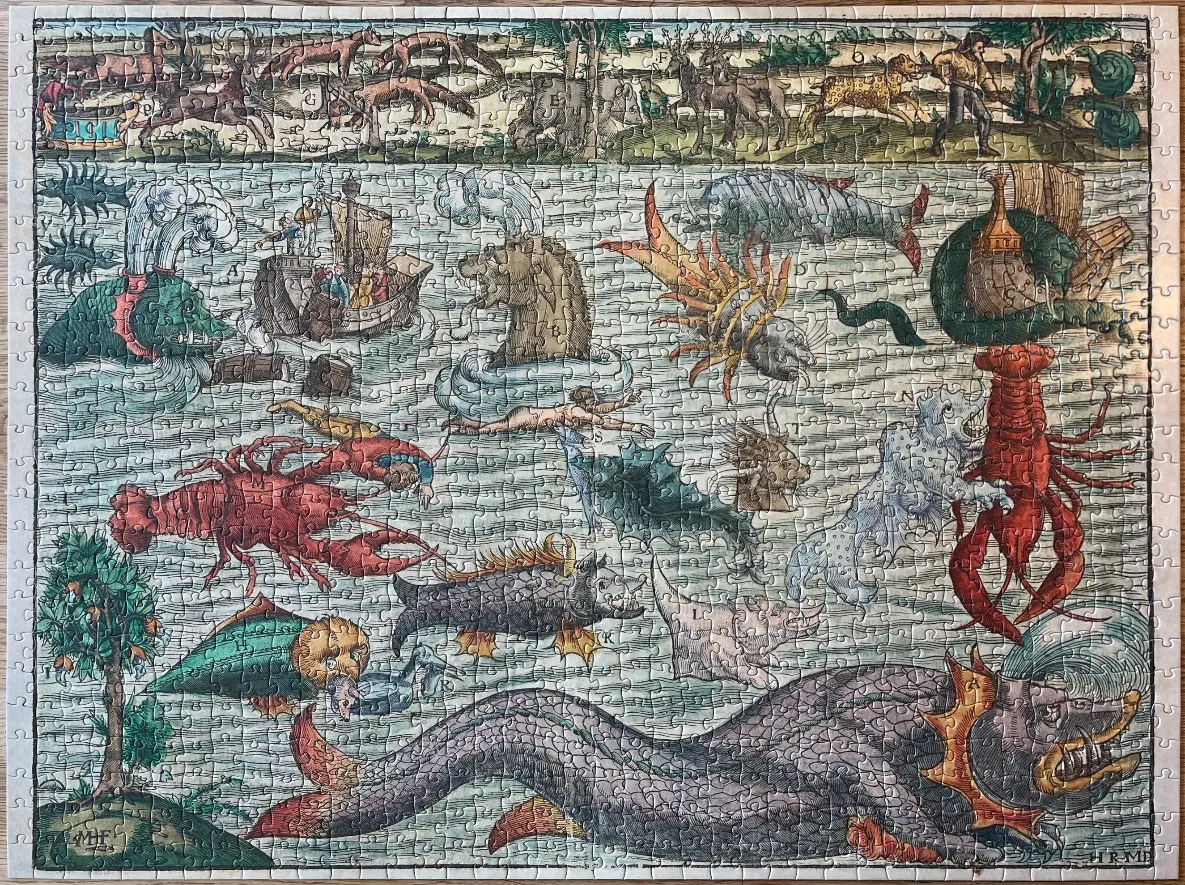 A historical style illustration of a busy sea filled with mythical monsters, ships, and land animals above.