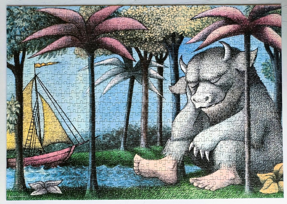 A whimsical illustration of a large horned monster sitting on a grassy shore by a sailboat.