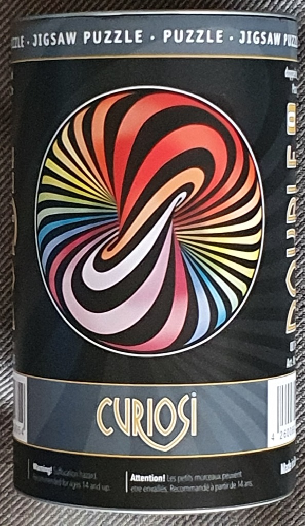 A colorful, swirling optical illusion of a torus shape against a dark background.