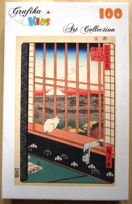 A ukiyo-e woodblock print showing a white cat sitting on a windowsill looking out at Mount Fuji.