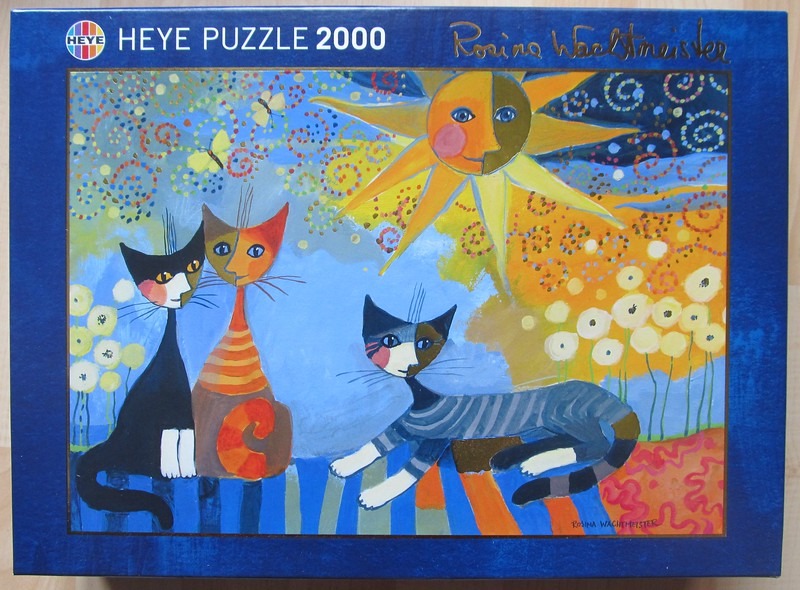 Stylized painting of three abstract cats under a dual-tone sun