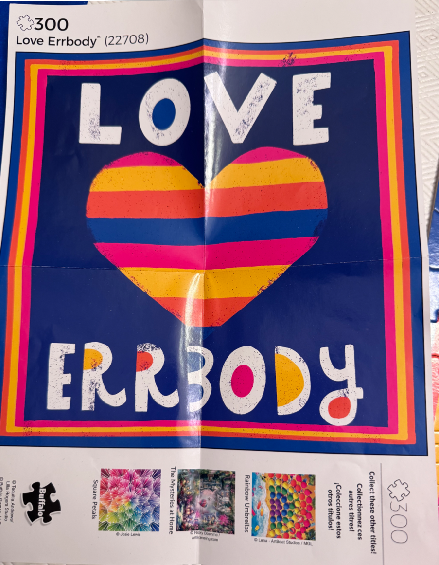 Graphic design featuring the text LOVE ERRBODY and a multicolored striped heart against a navy blue background.
