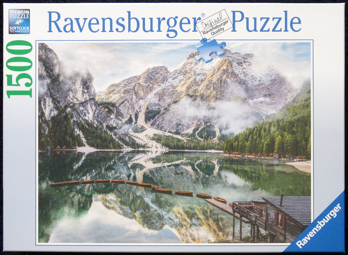 A photorealistic landscape of Lago di Braies in the Italian Dolomites featuring a wooden boat dock and mountain reflections.