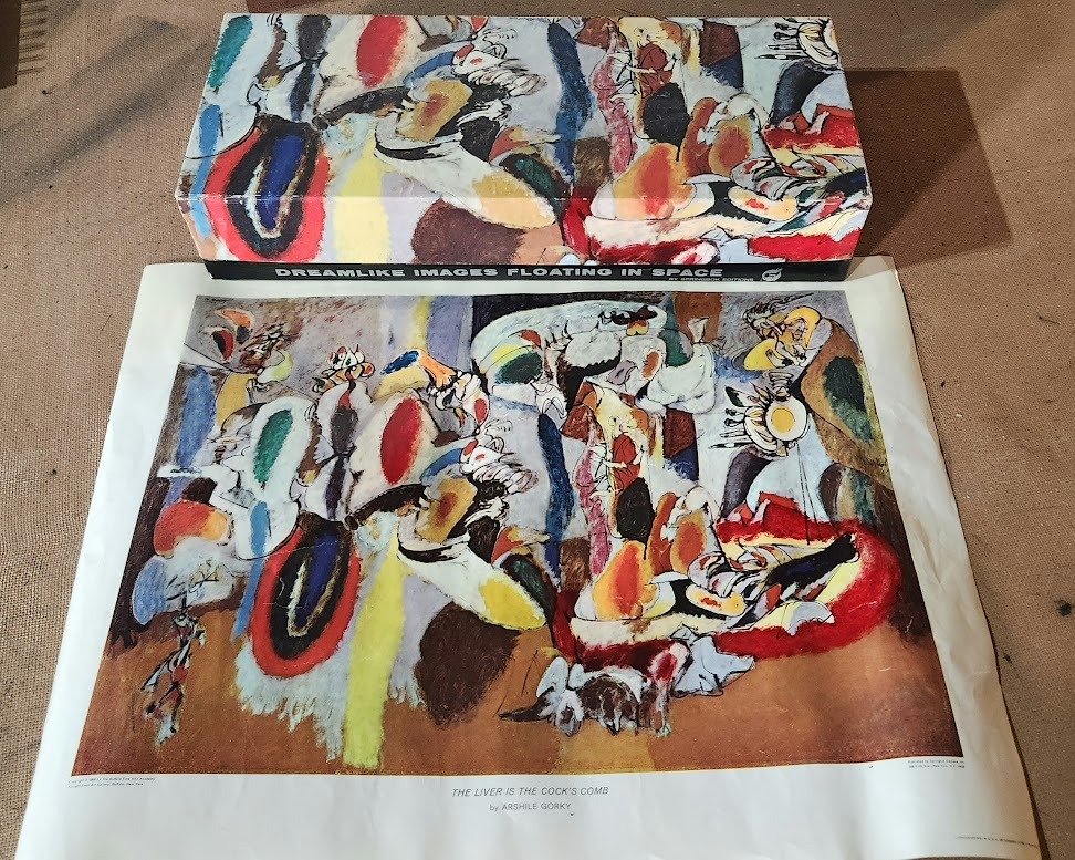An abstract expressionist painting with organic, swirling shapes in warm and cool tones, displayed on a textured surface.