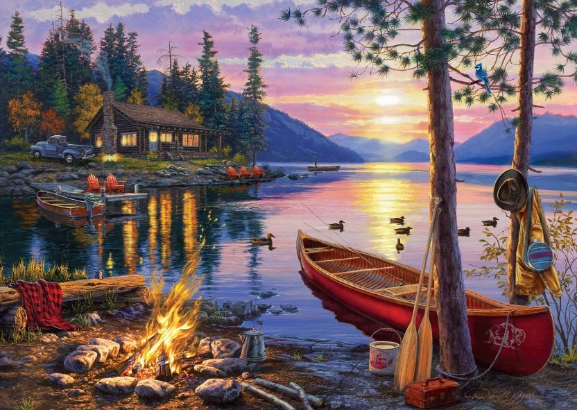 A peaceful lakeside scene at sunset with a log cabin, campfire, and canoe.