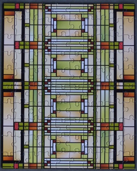 Geometric art nouveau stained glass window design in shades of olive, amber, and cream.