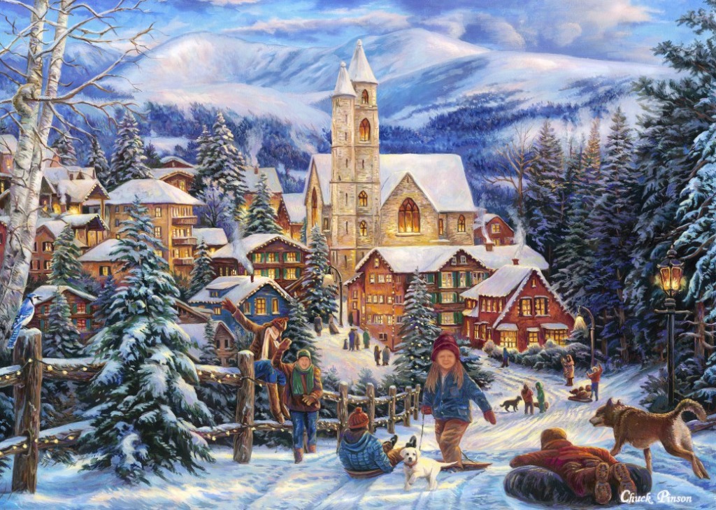 Children playing in the snow in front of a snow-covered village and church at the base of mountains.