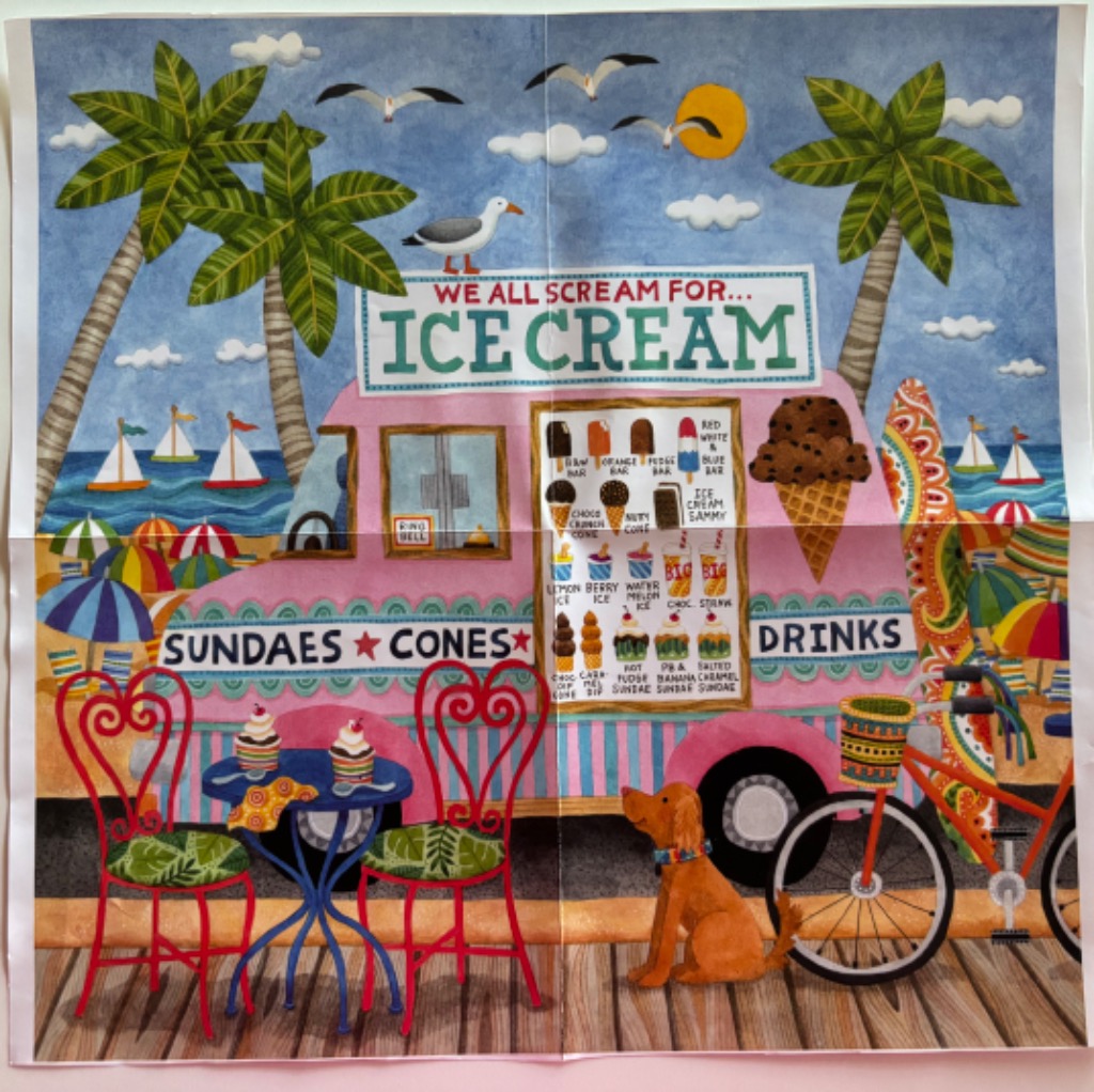 A pink ice cream truck parked on a beach boardwalk with tables, a bicycle, and a dog.