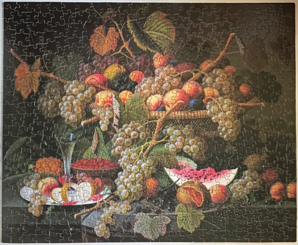 Still life oil painting featuring a bountiful arrangement of grapes, melons, and assorted fruits in a darkened room.