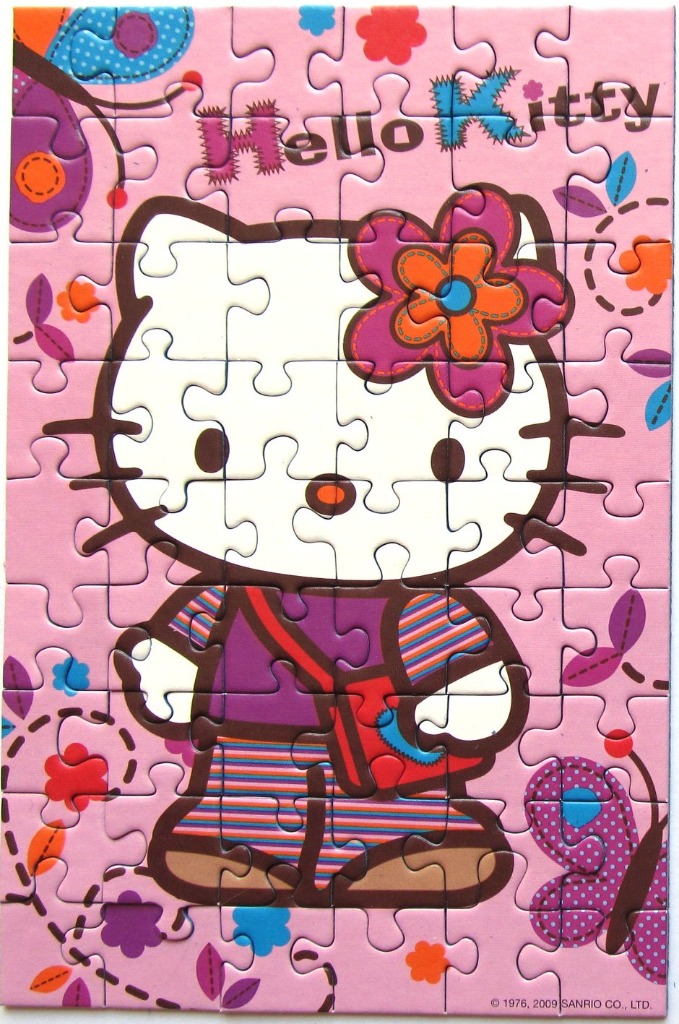 Hello Kitty character with a flower and butterflies on a pink background.