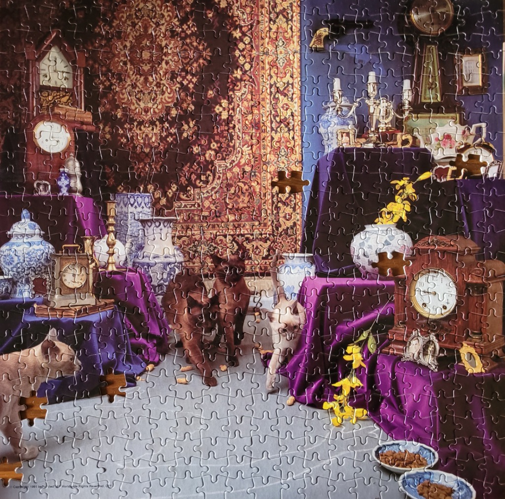 Oriental rug with antique clocks, vases, and cats in a richly decorated room.