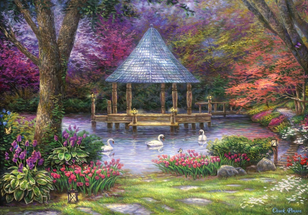 A gazebo sits in the middle of a tranquil pond surrounded by lush, colorful gardens and swans.