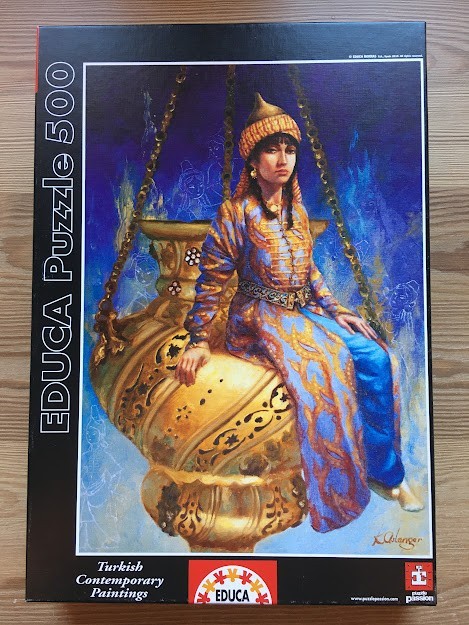 A painting of a woman in traditional attire sitting on a large, ornate golden hanging urn against a dark blue background.