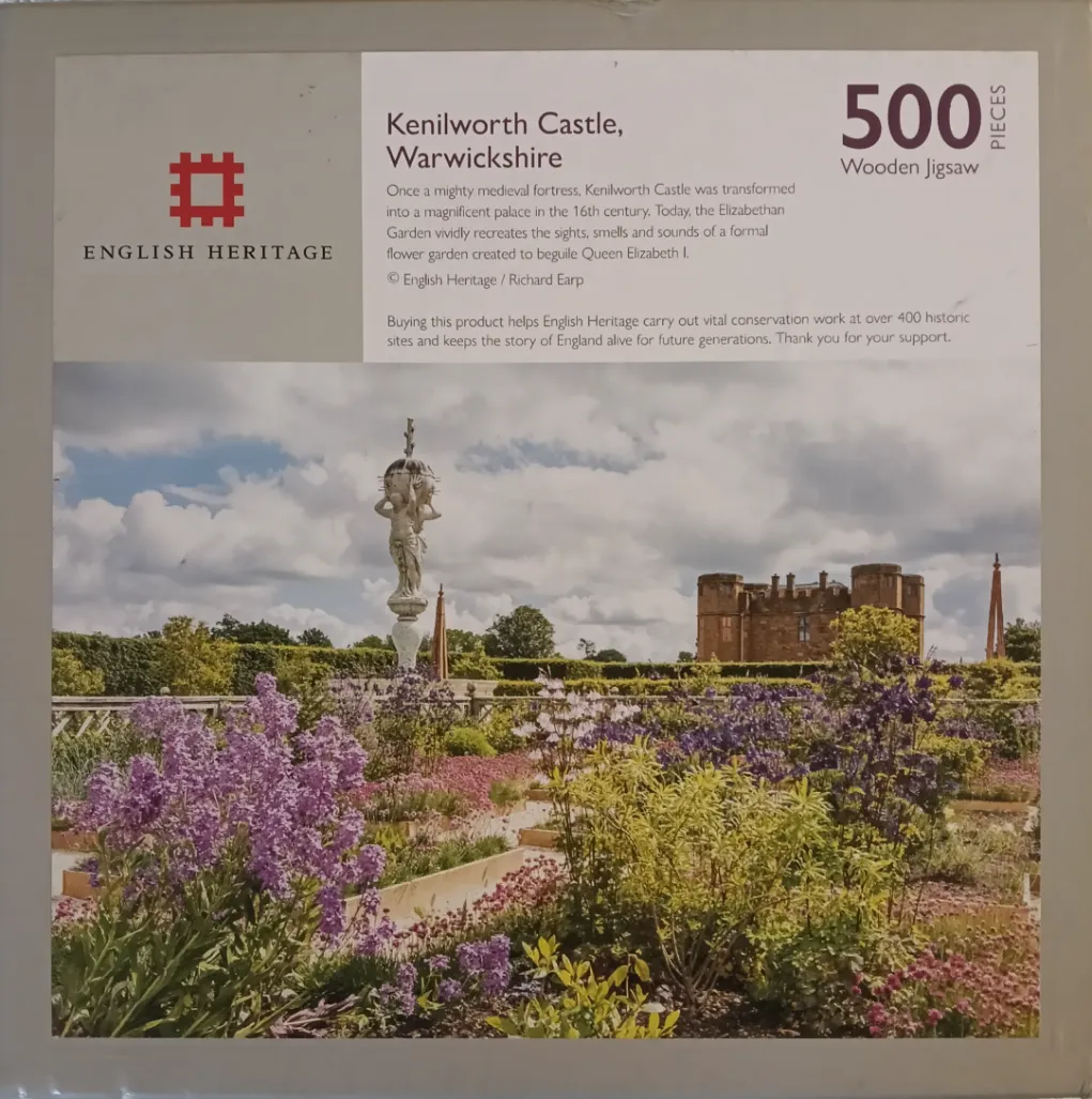 A photograph of Kenilworth Castle and its formal Elizabethan garden under a cloudy sky.