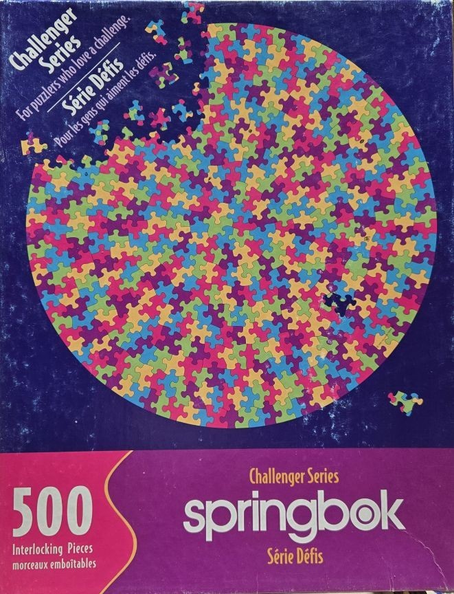A circular mosaic of multicolored interlocking puzzle pieces on a deep blue background.