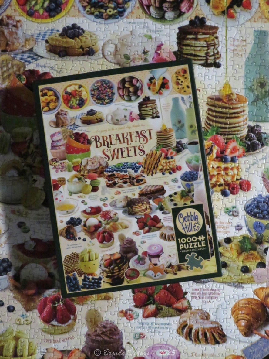 Collage of various breakfast foods including pancakes, waffles, macarons, and fruit on a light background.