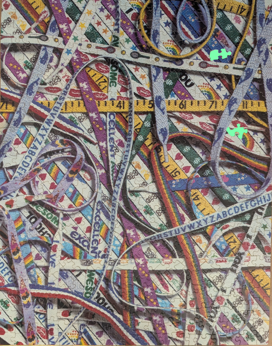 A chaotic tangle of colorful, patterned shoelaces and yellow measuring tapes