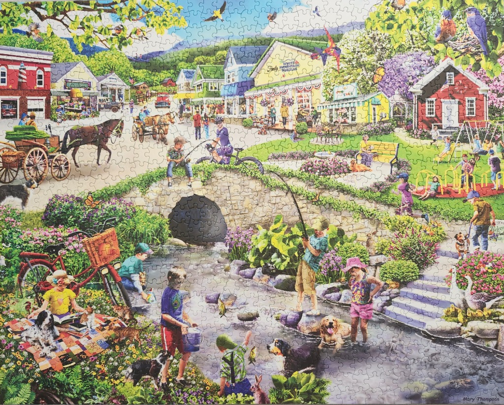 An idyllic village scene with people and pets enjoying a summer day by a stream and park.
